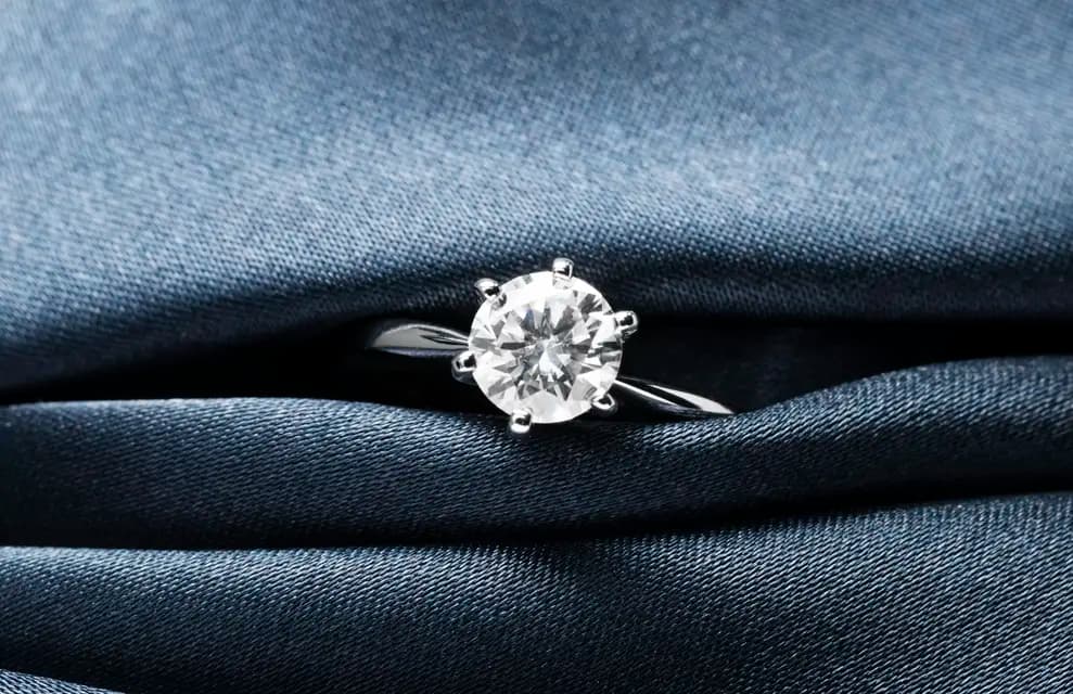 A high-precision view of a brilliant round cut lab-grown diamond in a modern setting.